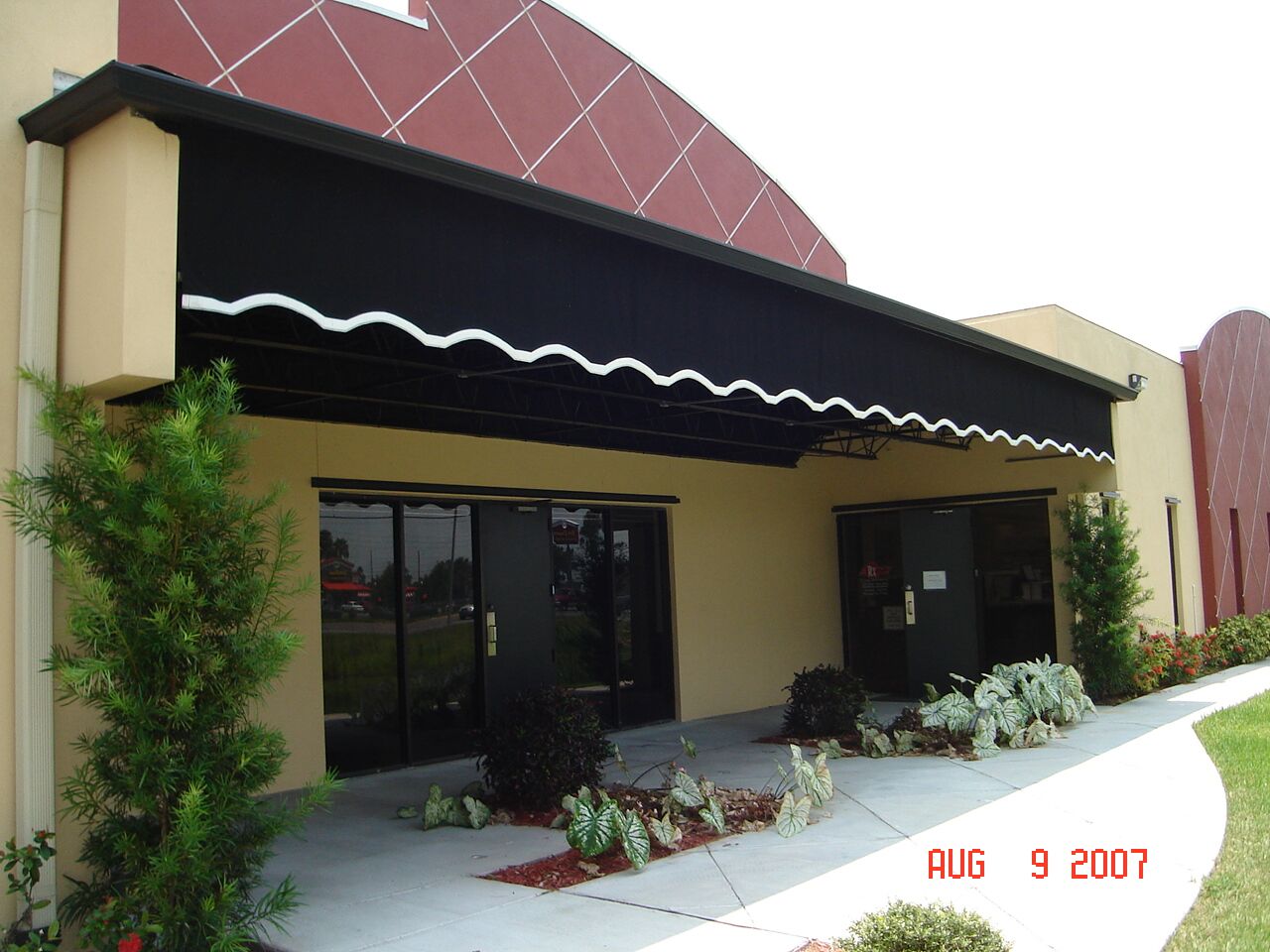 Custom black valance awning installation